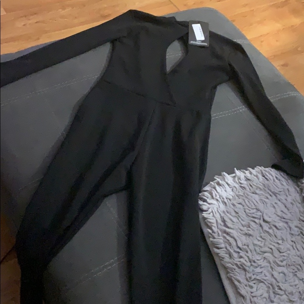 Black pretty little thing jump suit with cut out